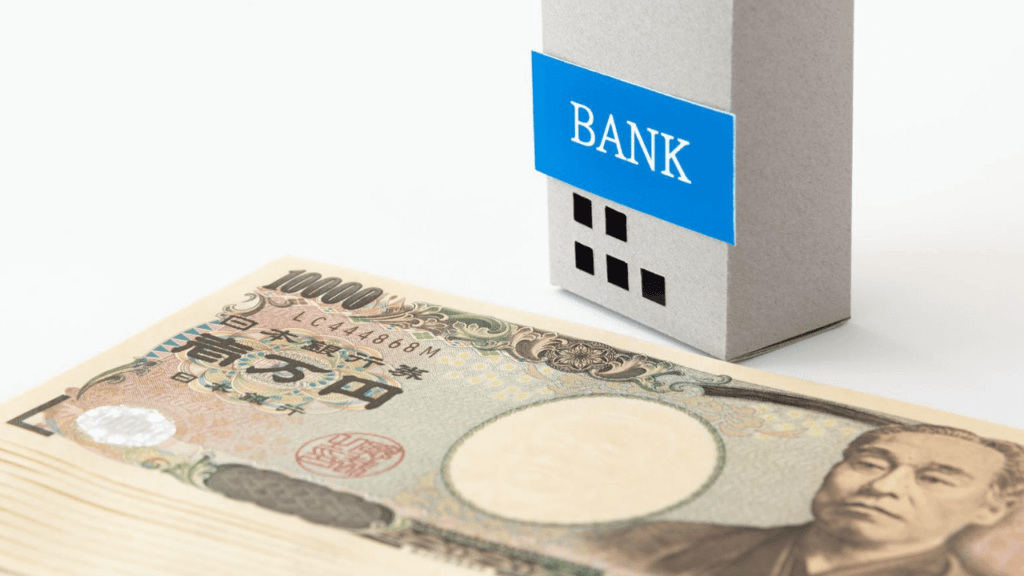 銀行の模型と札束